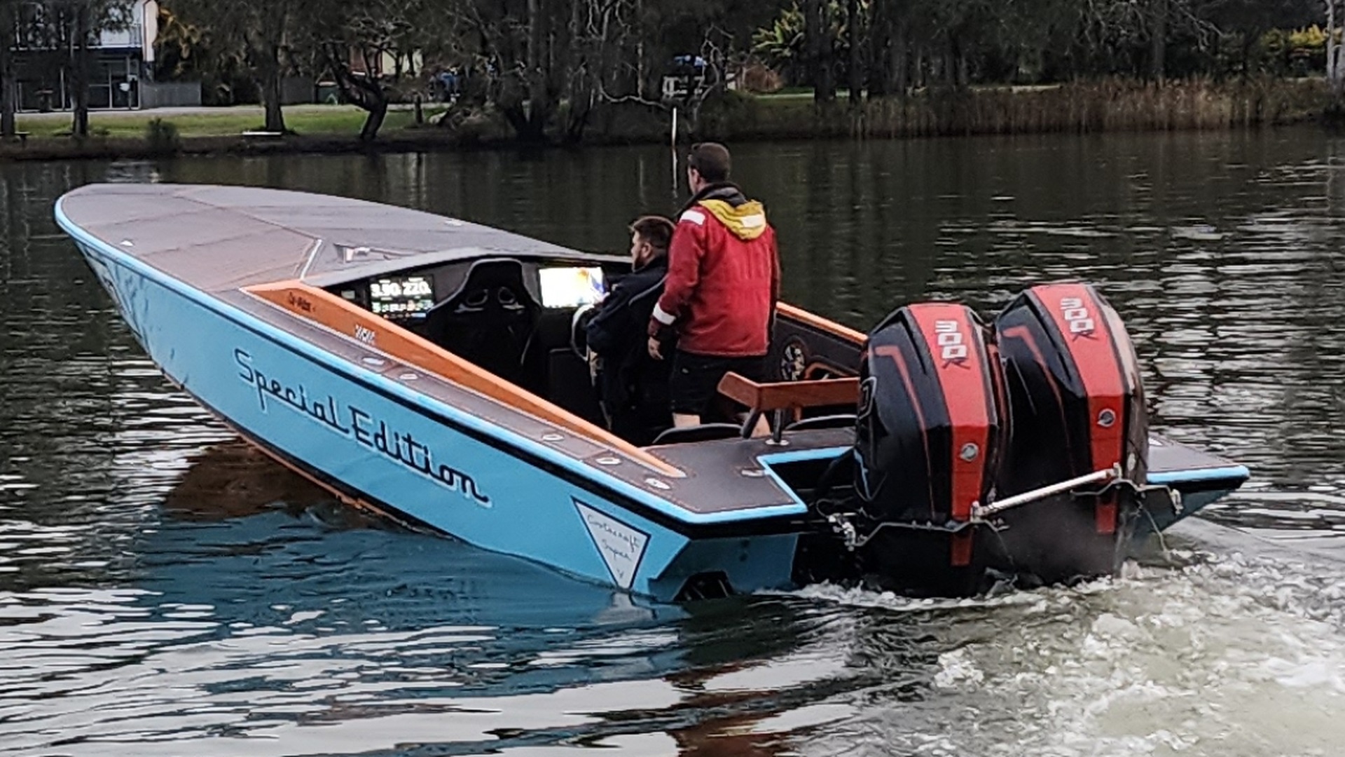 A classic ski boat under way on the lake, repowered with twin Mercury 300R outboards